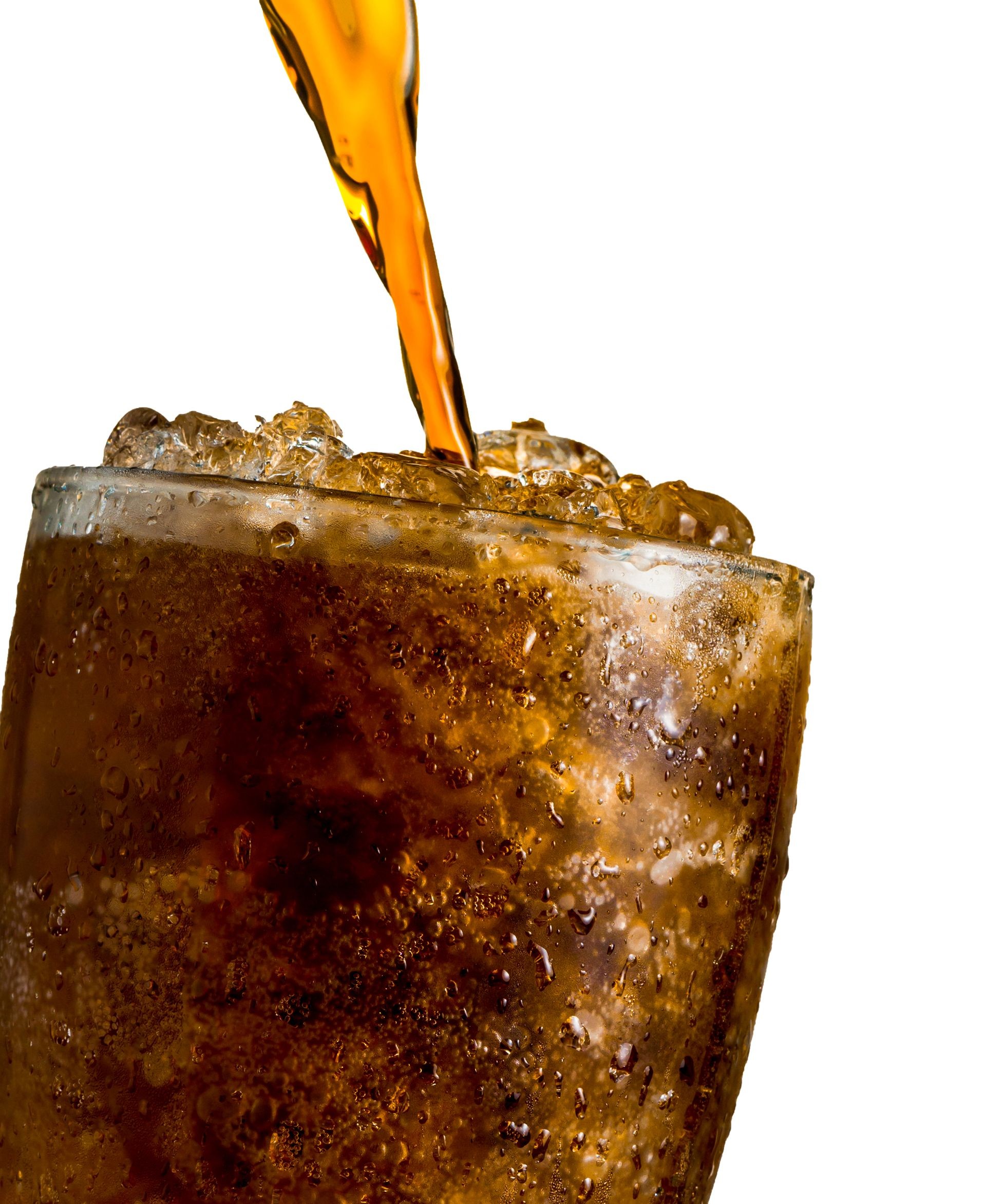 Closeup of soft drink pouring to glass with crushed ice cubes on white background. There is a drop of water on the transparent glass surface. Beverage mixed caffeine for freshness. Cool soft drink.