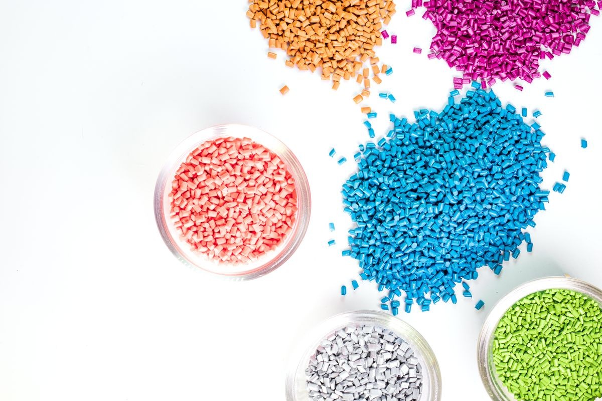 Plastic granules close up for holding,Colorful plastic granules with white background. and dollar money,Plastic Business.